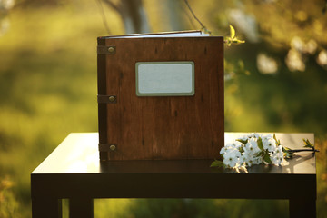 wooden photobook on the table. place for the inscription