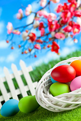 Colored Easter eggs on springtime background