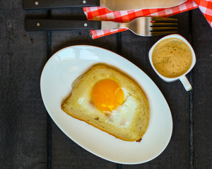 fried eggs in bread, scrambled eggs (yolk and white) sandwich. food background. top