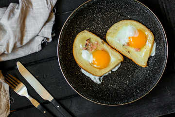 fried eggs in bread, scrambled eggs (yolk and white) sandwich. food background. top