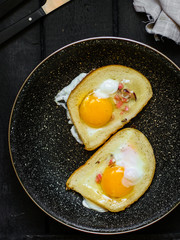 fried eggs in bread, scrambled eggs (yolk and white) sandwich. food background. top