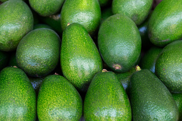Avocados background. Top view, avocado closeup