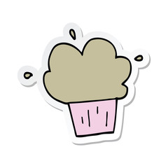 sticker of a cartoon cupcake