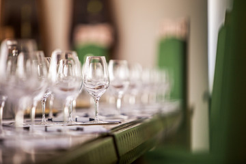 White rose and red wine glasses prepared for tasting.