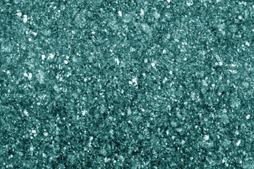 Granite surface as background in cyan tone.