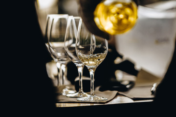 A Glass of White Wine at a Table Tasting