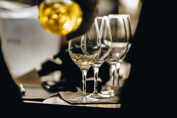 A Glass of White Wine at a Table Tasting