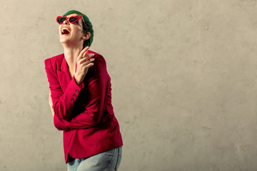 Delighted nice young woman feeling very positive