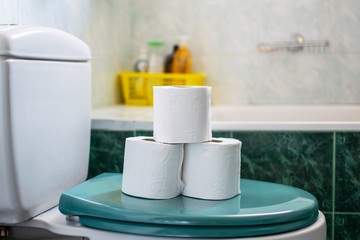 Toilets papers stacked on one another on a toilet's seat cover.Hygiene concept.