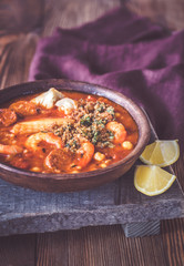 Portion of spanish fish and chorizo soup