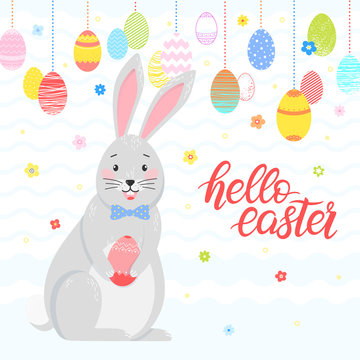 Easter typography.Hello Easter - hand drawn lettering with colorful eggs,different flowers and cute funny bunny. Seasons greetings card perfect for prints, flyers,banners,holiday invitations and more.
