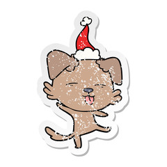 distressed sticker cartoon of a dancing dog wearing santa hat