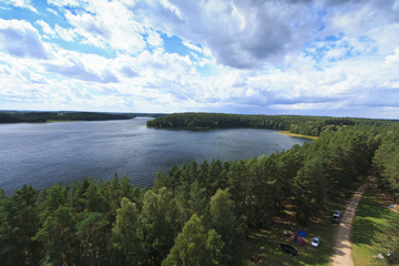 A resting place near a lake in the pine forest.