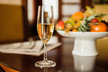 Glass of white wine with fruits