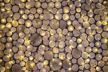 Wall texture from wood slab and Christmas garlands 