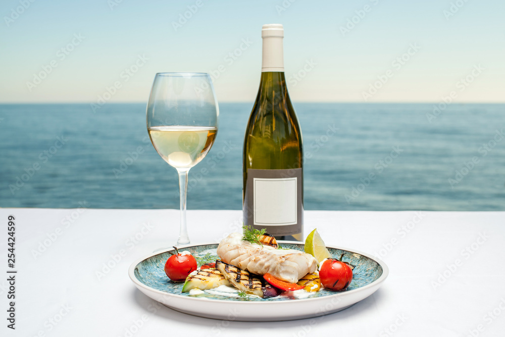 Wall mural dish with fish and wine