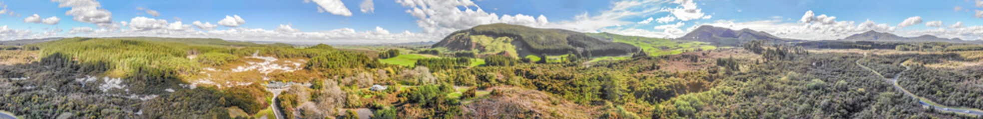 Fototapeta premium Wai-O-Tapu park and surrounding hills, Rotorua from the air, New Zealand