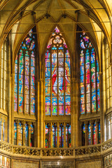 Fototapeta na wymiar Prague, Czech Republic. Stained-glass windows at main nave of the St. Vitus Cathedral, part of the Prague Castle complex. The frescoes (14th-16th centuries) depict scenes from the passion of Christ.