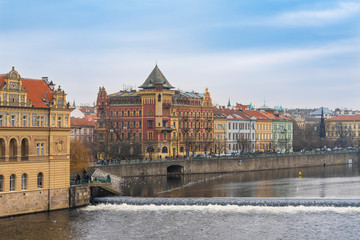 Czech Republic. Buildings right next to Charles Bridge on the right bank of the Vltava river in the historical Old Town of Prague.