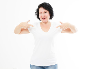 Portrait of smiling middle age caucasian woman wearing t shirt pointing at hemself by finger isolated on white template and blank background.