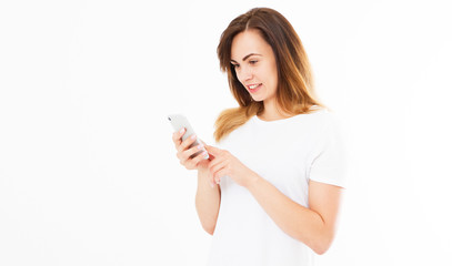 Fototapeta premium A beautiful woman looks at a photo on her device isolated on white background.