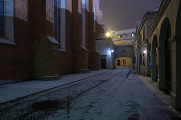 Street in Warsaw old town at night