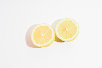 two half lemons on white background