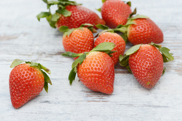 Strawberries lying on wood