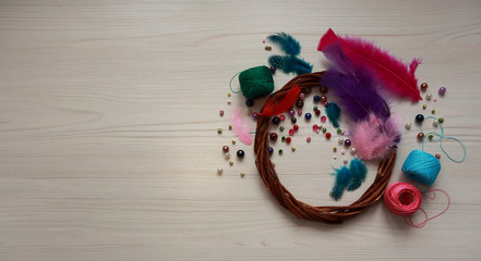 Fototapeta na wymiar threads, feathers and beads