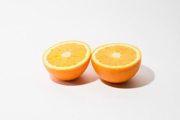 Orange halves on white background