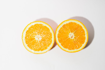 Orange halves on white background