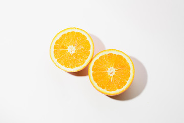 Orange halves on white background