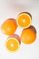 Orange halves on white background