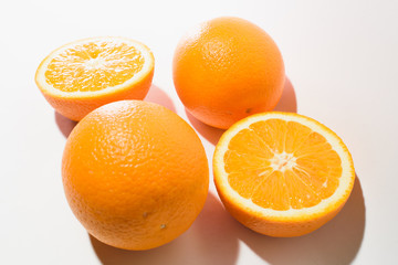 Orange halves on white background