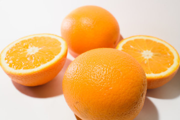 Orange halves on white background