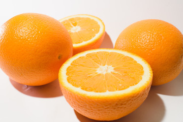 Orange halves on white background