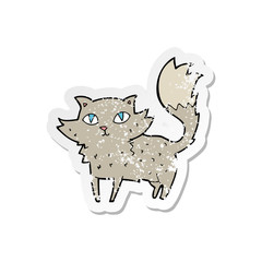 retro distressed sticker of a cartoon cat