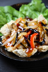 Chinese fish with vegetables sauce on top