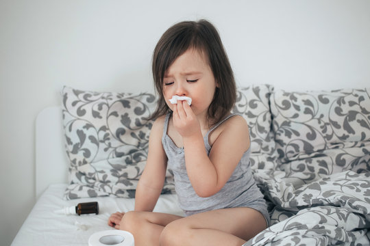  The girl got sick. The girl has snot and cough. The girl is in bed and sick