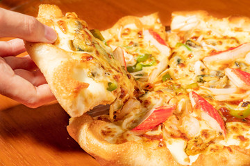 Seafood pizza on a wooden table