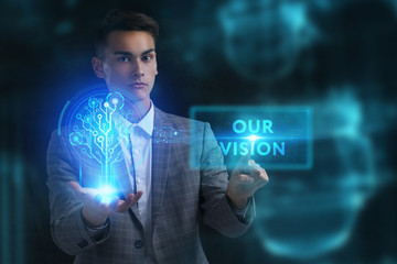 The concept of business, technology, the Internet and the network. A young entrepreneur working on a virtual screen of the future and sees the inscription: Our vision