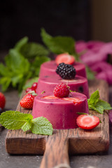Summer dessert with berries and yogurt as a jelly pudding