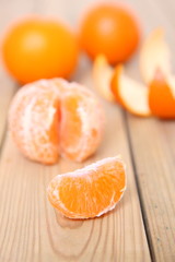 peeled orange fruit citrus tankan on wooden background
