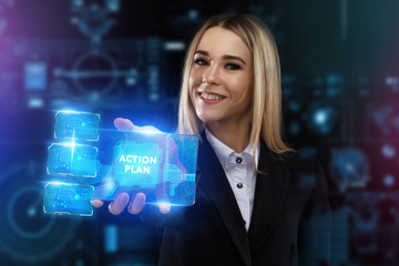 The concept of business, technology, the Internet and the network. A young entrepreneur working on a virtual screen of the future and sees the inscription: Action plan