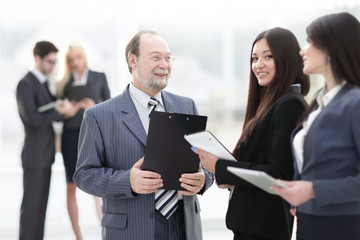 close up.group of business people standing in lobby of office.