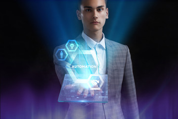 The concept of business, technology, the Internet and the network. A young entrepreneur working on a virtual screen of the future and sees the inscription: Automation