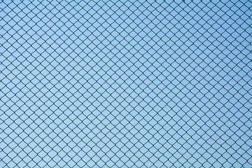 Wire mesh steel on blue sky background