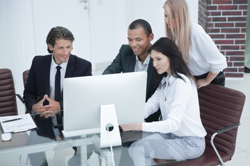 business people discussing financial information,sitting at his Desk
