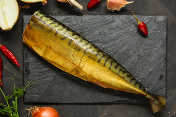 mackerel smoked fish and other ingredients. food background. copy space