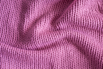 Fototapeta na wymiar Pink knitting wool texture background